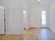 Bright living space featuring access to a bathroom and two additional rooms at 3025 Bermuda Sloop Cir, Ruskin, FL 33570