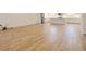 Spacious living room with stylish wood flooring, recessed lighting, and plenty of natural light at 3025 Bermuda Sloop Cir, Ruskin, FL 33570