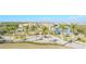 Scenic aerial view of neighborhood with palm trees and manicured landscaping at 3025 Bermuda Sloop Cir, Ruskin, FL 33570