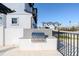 Outdoor grill station on a sunny day, set against a backdrop of modern buildings and a clear blue sky at 3025 Bermuda Sloop Cir, Ruskin, FL 33570