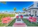 Outdoor lounge area features cozy seating around a fire pit, fostering relaxation and gatherings at 3025 Bermuda Sloop Cir, Ruskin, FL 33570