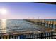 Sunlit shot showcasing a pier stretching out over the water on a beautiful day at 3025 Bermuda Sloop Cir, Ruskin, FL 33570