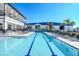 Lap pool offers a refreshing workout space for fitness enthusiasts with poolside lounges at 3025 Bermuda Sloop Cir, Ruskin, FL 33570