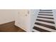 Close up of a Stairway featuring hardwood treads and white risers and trim at 3025 Bermuda Sloop Cir, Ruskin, FL 33570