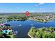 Breathtaking aerial view showcases waterfront homes surrounding a serene lake in a lush, green community at 310 Manns Harbor Dr, Apollo Beach, FL 33572