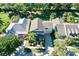 Aerial view of the home showing lush landscaping and surrounding neighborhood at 310 Manns Harbor Dr, Apollo Beach, FL 33572