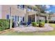 Backyard patio with string lights, grill, and a fire pit with comfortable seating at 310 Manns Harbor Dr, Apollo Beach, FL 33572