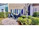 Backyard patio with comfortable seating, a grill, and lush landscaping at 310 Manns Harbor Dr, Apollo Beach, FL 33572