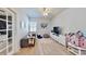 Bright bedroom features neutral decor, a ceiling fan, and a cozy sitting area with lots of natural light at 310 Manns Harbor Dr, Apollo Beach, FL 33572
