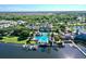Aerial view of a community pool featuring lush surroundings, water views and direct access to boat slips at 310 Manns Harbor Dr, Apollo Beach, FL 33572