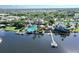 Aerial view captures a lagoon style pool surrounded by luscious landscaping and featuring a waterfront view at 310 Manns Harbor Dr, Apollo Beach, FL 33572