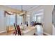 Bright dining room showcases a table for six, with an open view to the living room at 310 Manns Harbor Dr, Apollo Beach, FL 33572