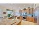 Eat-in kitchen features granite countertops, stainless appliances, tile floors, and ample cabinets at 310 Manns Harbor Dr, Apollo Beach, FL 33572