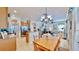 Open-concept living area shows the kitchen and dining area and has stairs leading to the second floor at 310 Manns Harbor Dr, Apollo Beach, FL 33572