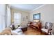 Cozy living room with hardwood floors, a sectional sofa, a decorative piano, and tasteful decor for a relaxed ambiance at 310 Manns Harbor Dr, Apollo Beach, FL 33572