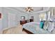 Spacious primary bedroom boasts tray ceilings, neutral colors, and ample closet space at 310 Manns Harbor Dr, Apollo Beach, FL 33572