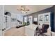 Spacious home office featuring a modern ceiling fan, a treadmill, large desk, and ample natural light at 310 Manns Harbor Dr, Apollo Beach, FL 33572