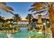 Resort style pool with a lighthouse overlooking a body of water at 310 Manns Harbor Dr, Apollo Beach, FL 33572