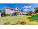 Spacious lawn with screened lanai and backyard patio at 310 Manns Harbor Dr, Apollo Beach, FL 33572