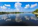 Scenic lake view reflecting the sky, showcasing the community's serene waterfront setting at 310 Manns Harbor Dr, Apollo Beach, FL 33572