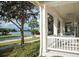 Enjoy beautiful waterfront views from the porch, with a clear sightline to a lake or canal and comfortable porch swings at 310 Manns Harbor Dr, Apollo Beach, FL 33572