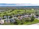 Aerial view of a residential neighborhood with well-maintained homes and green spaces near a golf course at 3537 Valencia Cove Court, Land O Lakes, FL 34639