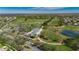 Scenic aerial view of the golf course with lush greens, sparkling water features, and beautifully landscaped surroundings at 3537 Valencia Cove Court, Land O Lakes, FL 34639