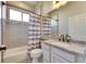 Well-lit bathroom featuring a shower-tub combination, granite countertop, and ample mirror at 3537 Valencia Cove Court, Land O Lakes, FL 34639