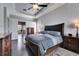 Well-lit main bedroom with decorative ceiling, and access to the ensuite bath and walk-in closet at 3537 Valencia Cove Court, Land O Lakes, FL 34639