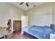 Bedroom with a bed, engineered wood floors, closet and ceiling fan at 3537 Valencia Cove Court, Land O Lakes, FL 34639