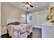 Bedroom with a bed, engineered wood floors, closet and ceiling fan at 3537 Valencia Cove Court, Land O Lakes, FL 34639