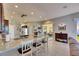 Gourmet kitchen with a large island, granite countertops, stainless steel appliances, and easy access to the outdoor patio at 3537 Valencia Cove Court, Land O Lakes, FL 34639