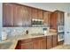 Contemporary kitchen with granite counters, stainless appliances, and a stylish tile backsplash, perfect for culinary enthusiasts at 3537 Valencia Cove Court, Land O Lakes, FL 34639