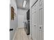 Convenient laundry room featuring modern washer and dryer, storage cabinets, and tile flooring at 3537 Valencia Cove Court, Land O Lakes, FL 34639
