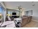 Bright and airy living room with tile floors, recessed lighting, and direct access to the screened in patio at 3537 Valencia Cove Court, Land O Lakes, FL 34639