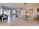 Open-concept living room with tile floors, dining table and chairs at 3537 Valencia Cove Court, Land O Lakes, FL 34639