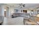 Spacious living room offers tile flooring, a large sectional sofa, and plenty of natural light at 3537 Valencia Cove Court, Land O Lakes, FL 34639