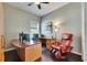 Office space featuring hardwood floors, large window, and room for office and massage furniture at 3537 Valencia Cove Court, Land O Lakes, FL 34639