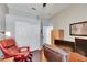 Comfortable home office with dark wood floors, closet, desk and ergonomic seating at 3537 Valencia Cove Court, Land O Lakes, FL 34639