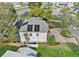 An aerial view of the back of the house highlighting the backyard, solar panels and paver driveway at 3605 E Tampa Cir, Tampa, FL 33629
