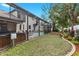 Home with a screened-in pool, jacuzzi, yard, garden and brick paver patio at 3605 E Tampa Cir, Tampa, FL 33629