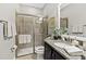 Bathroom features a glass shower, granite vanity top, and sleek fixtures at 3605 E Tampa Cir, Tampa, FL 33629