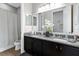 Modern bathroom with a double vanity and granite countertop offering a clean and stylish space at 3605 E Tampa Cir, Tampa, FL 33629