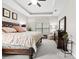 Beautiful bedroom with a tray ceiling, ceiling fan, and natural light, creating a cozy atmosphere at 3605 E Tampa Cir, Tampa, FL 33629