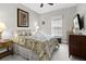 Well-decorated bedroom featuring large bed, dresser, and decor, providing a welcoming space at 3605 E Tampa Cir, Tampa, FL 33629