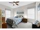 Charming bedroom featuring a ceiling fan and natural light, creating a cozy and inviting space at 3605 E Tampa Cir, Tampa, FL 33629