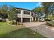 Beautiful two-story home with a two-car garage, lovely landscaping, and brick-paved driveway at 3605 E Tampa Cir, Tampa, FL 33629
