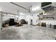 Spacious two car garage with lots of storage space, workbench and shelving at 3605 E Tampa Cir, Tampa, FL 33629