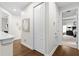 Hallway with hardwood floors with views into bedrooms and closet space at 3605 E Tampa Cir, Tampa, FL 33629