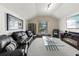Spacious living room with vaulted ceilings and comfortable leather seating at 3605 E Tampa Cir, Tampa, FL 33629
